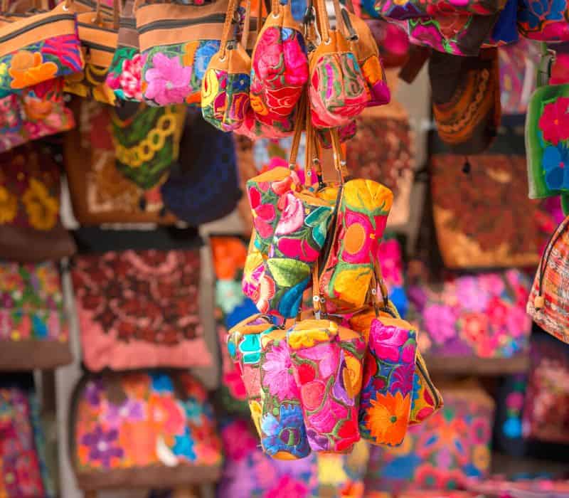 colorful purses for sale in oaxaca market