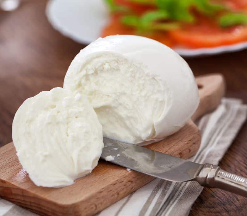 ball of mozzarella cheese, which can be used as a oaxaca cheese substitute