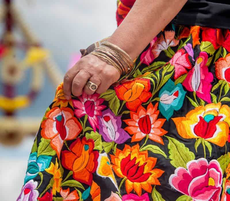woman wearing colorful oaxaca textile skirt