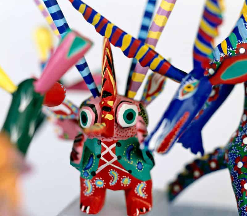small colorful alebrijes statues, which are a hybrid animal