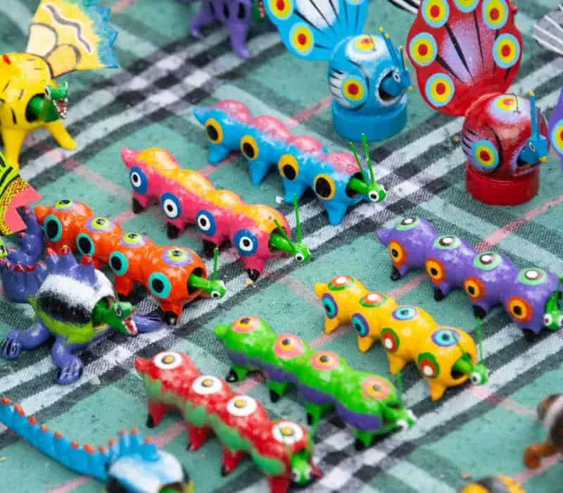 small colorful alebrijes statues, which are a hybrid animal