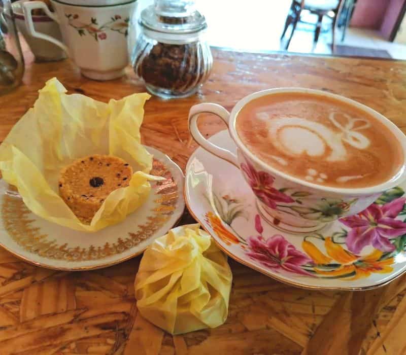 latte and small cookie at Café Panchatantra in Mazunte, Mexico
