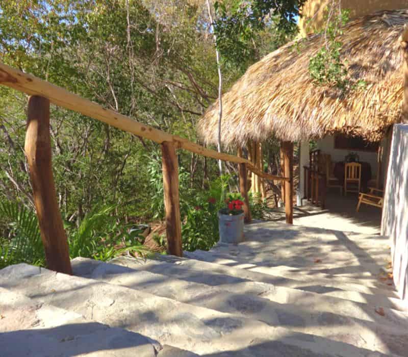 palapa thatched-roof building at El Eden Bungalows Mazunte