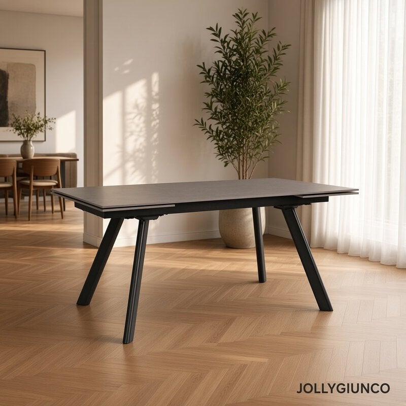 Rectangular dark wood table with angled black legs in a bright living room.