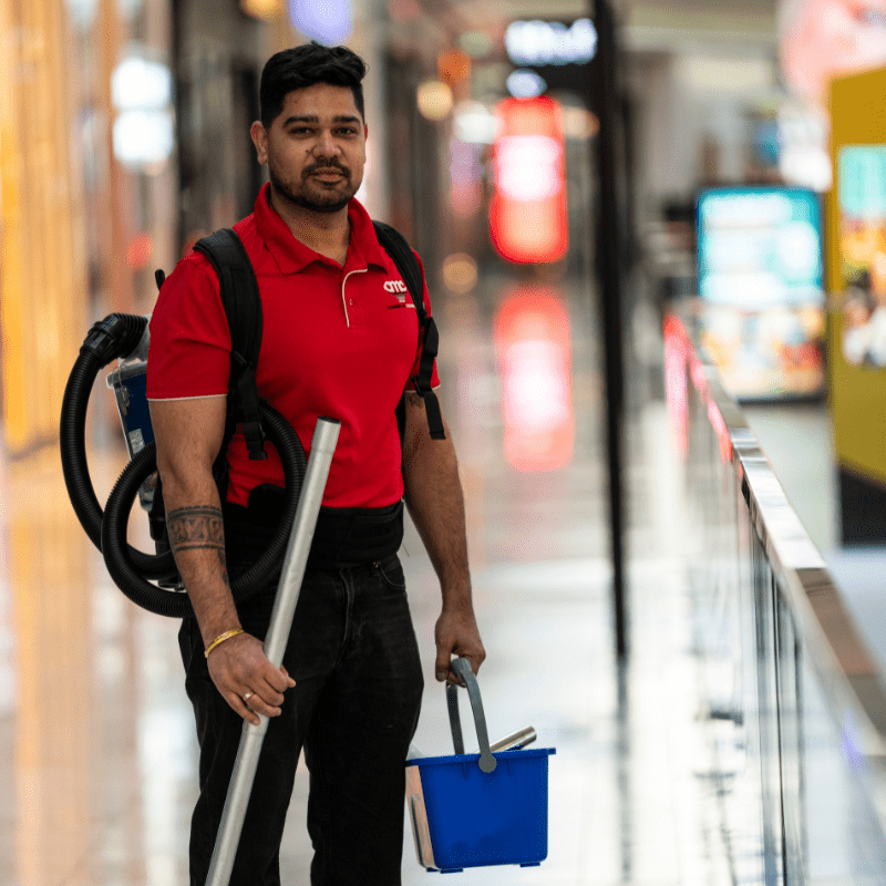 AMC team member working an early-morning shopping centre shift before stores open.