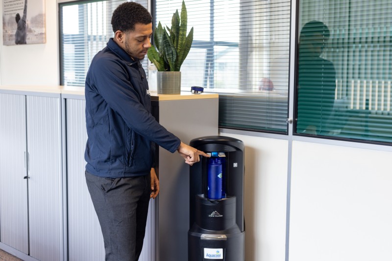 Man using mains fed water cooler