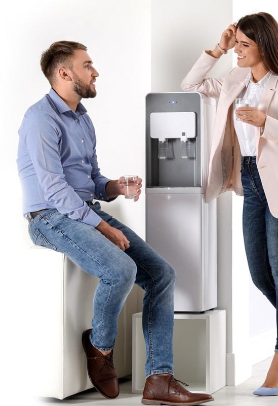 Employees gathered at the office water cooler