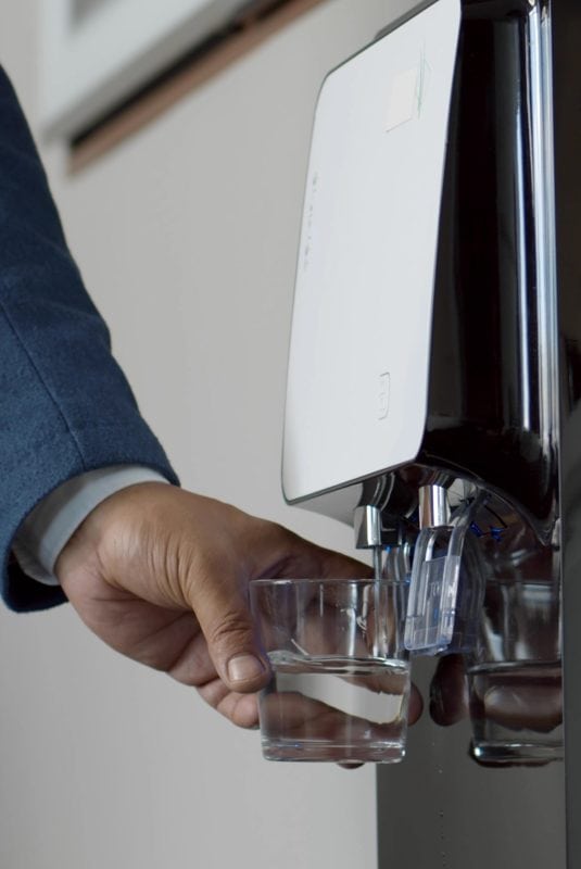 man using water cooler