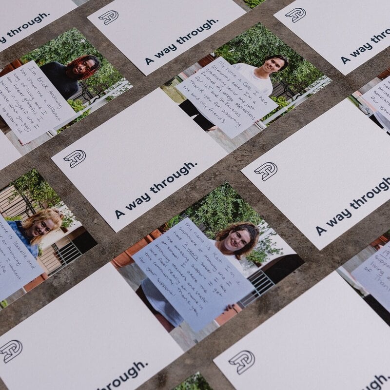 Printed brochures from Archway Academy featuring photos of diverse students in recovery engaged in learning, peer connection, and campus life
