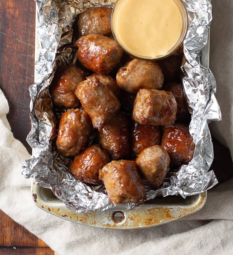 finished sausage with mustard dipping sauce