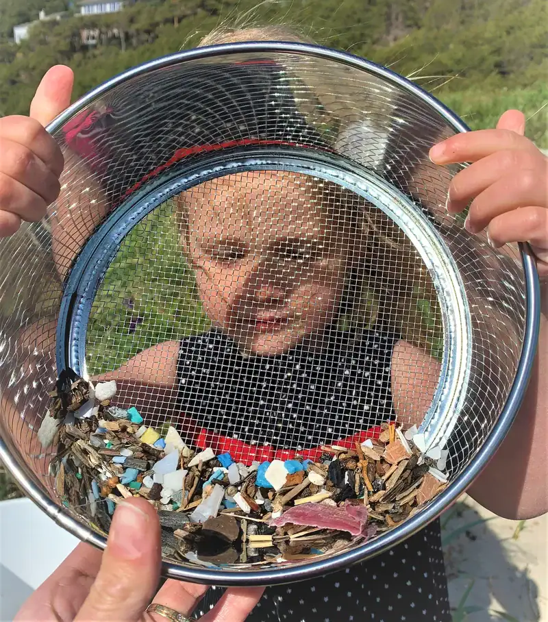 youth-steward-sifts-microplastic-beach-ocean-blue-project