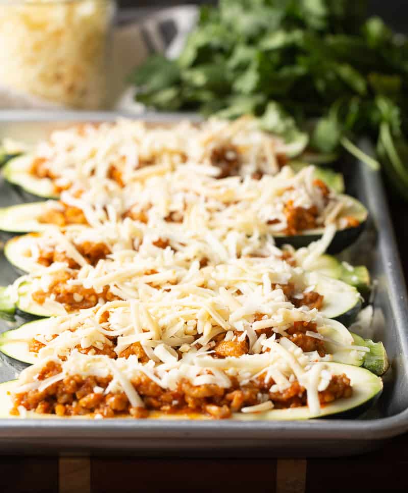 Zucchini Boats stuffed with chicken and topped with cheese