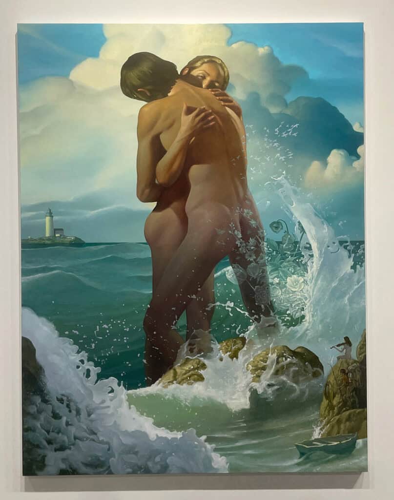 A painting of two nude figures embracing on rocks amid ocean waves, with a distant lighthouse and dramatic clouds. Sunlight highlights their bodies as water splashes around them, capturing the passion and energy of Miami Art Week 2025.