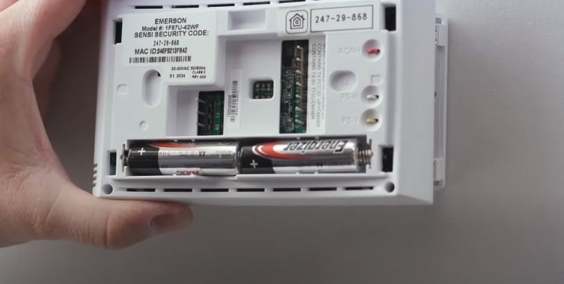 inserting battery in emerson thermostat