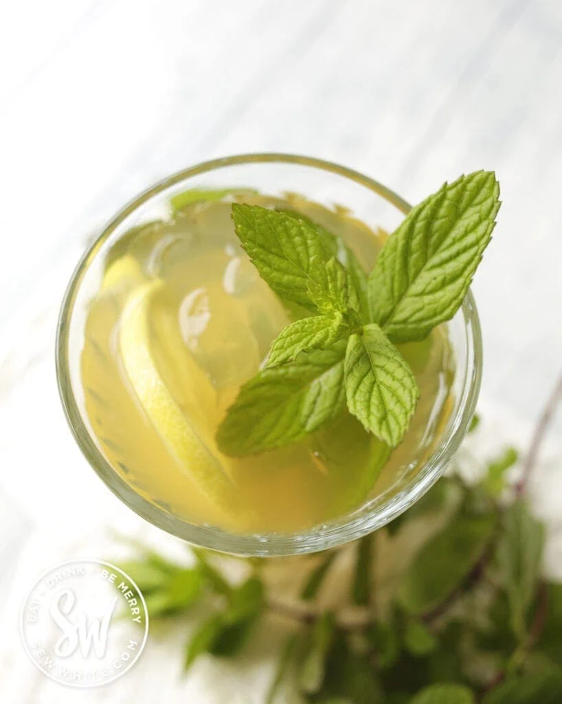 sprig of fresh mint in an apple rum cocktail