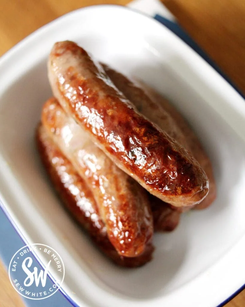 top view of golden brown oven cooked sausages