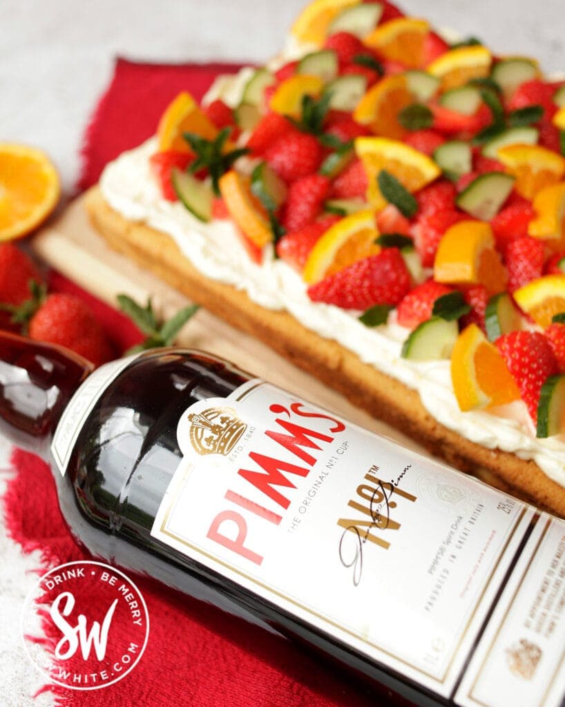 Pimm's bottle next to the pimms traybake