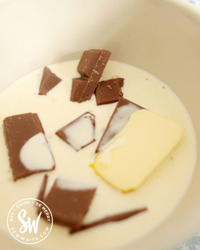 chocolate, butter and heavy cream in a bowl