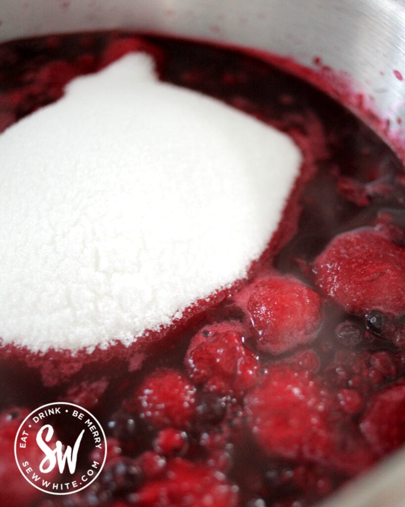 adding sugar to the Mulled Wine Jam