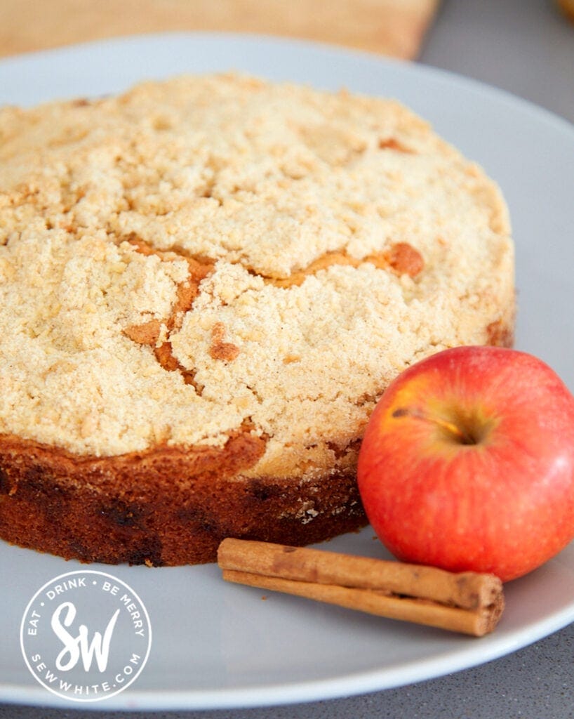 apple crumble cake with an apple and cinnamon stick