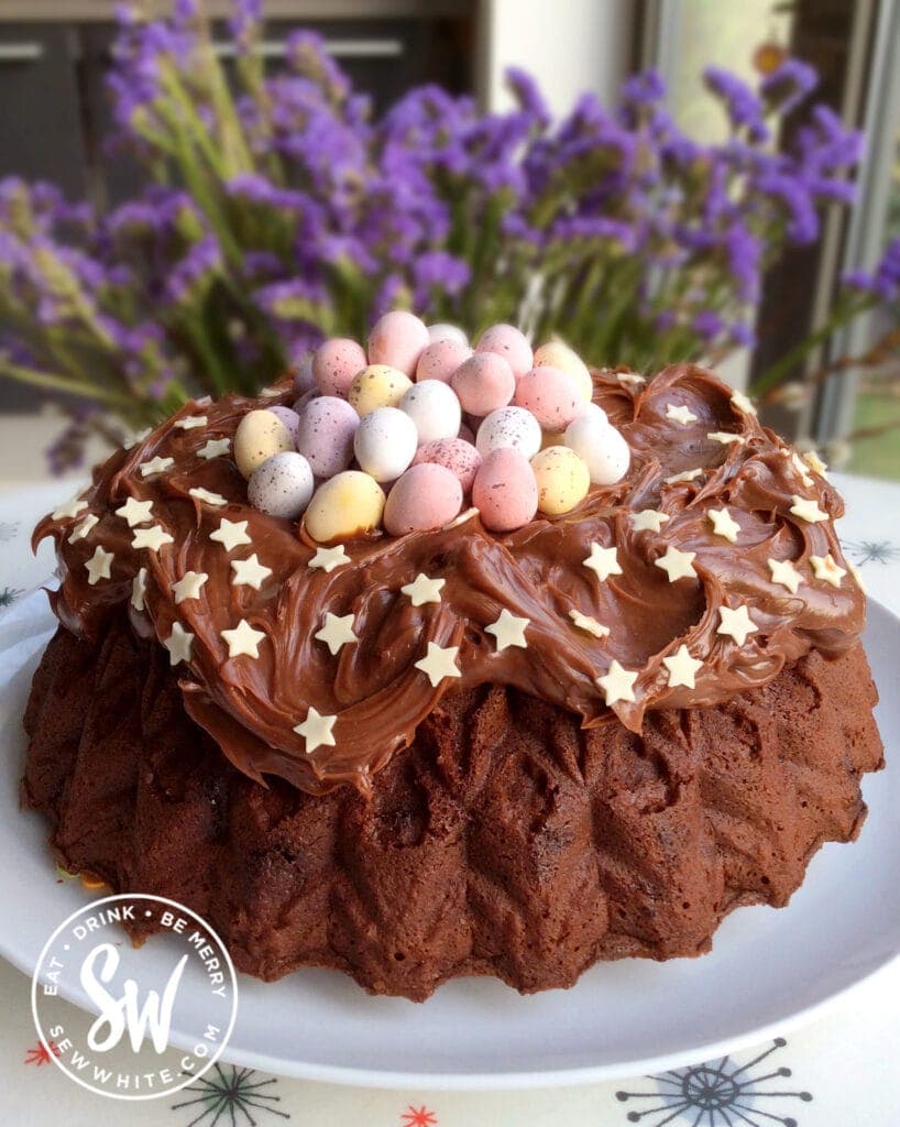 Chocolate Bundt Cake nest cake with chocolate eggs and mini eggs on top