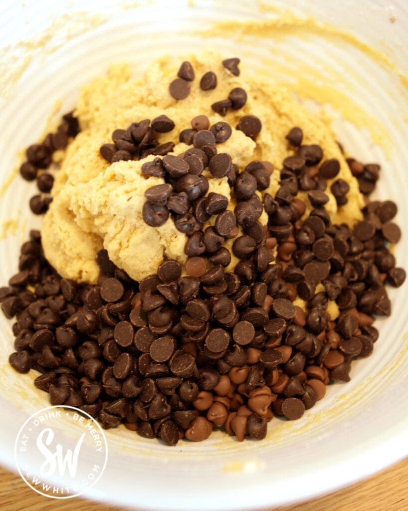 adding chocolate chips to the NYC cookie dough