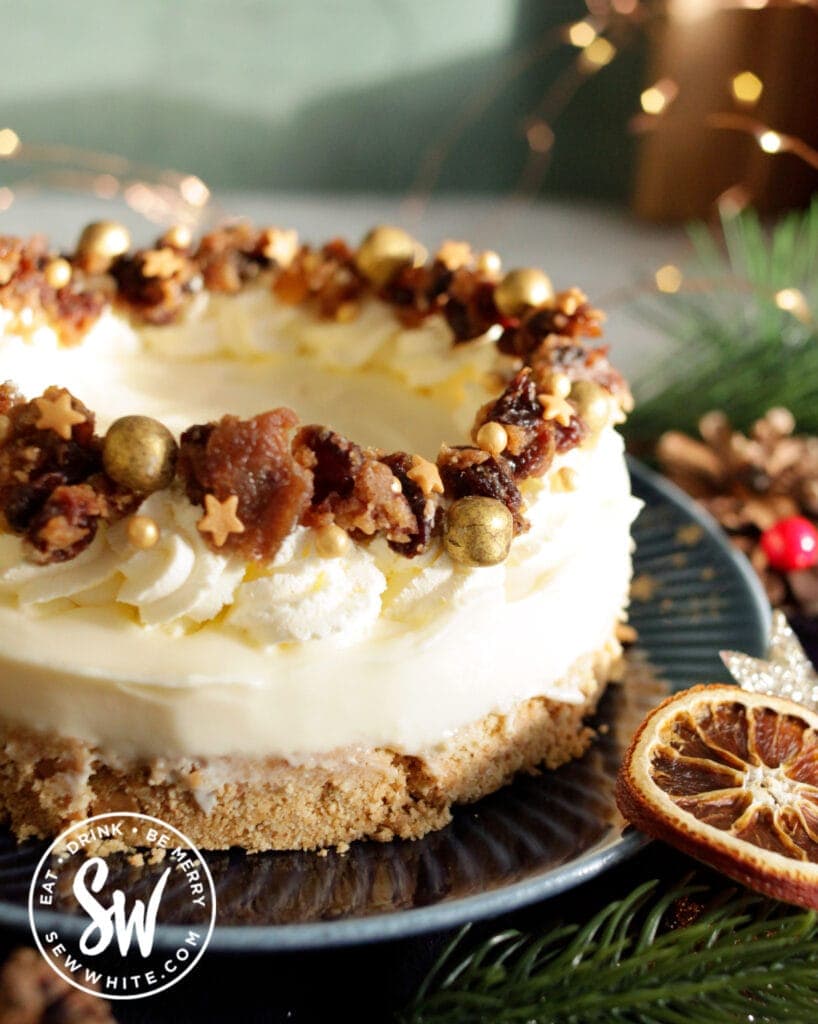 close up of the Christmas Pudding cheesecake decorated with christmas pudding and sprinkles