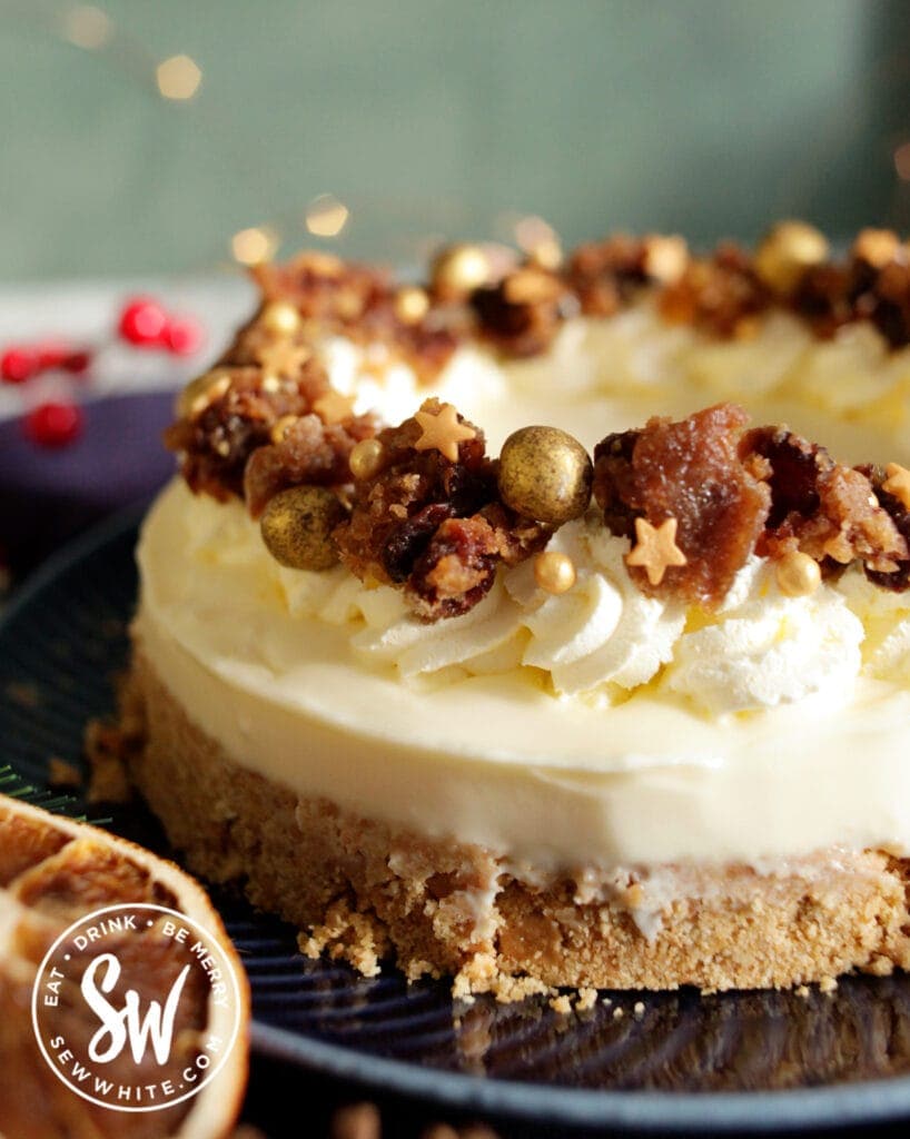 Christmas Pudding cheesecake on a blue plate