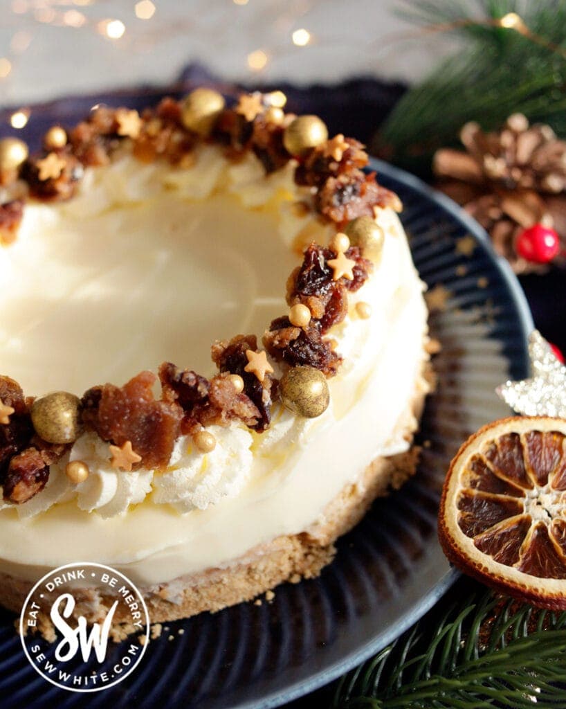 close up of a Christmas Pudding cheesecake with golden star sprinkles