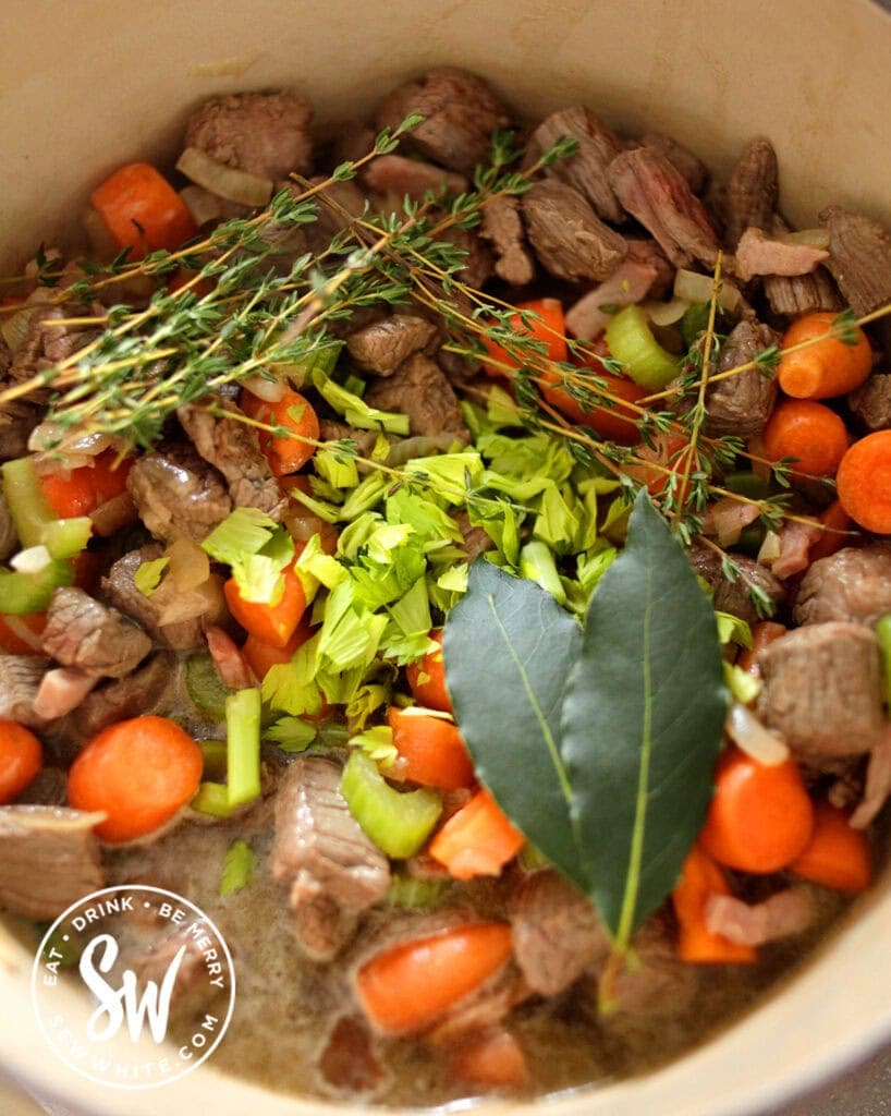 ingredients to make easy steak and ale pie in a casserole dish