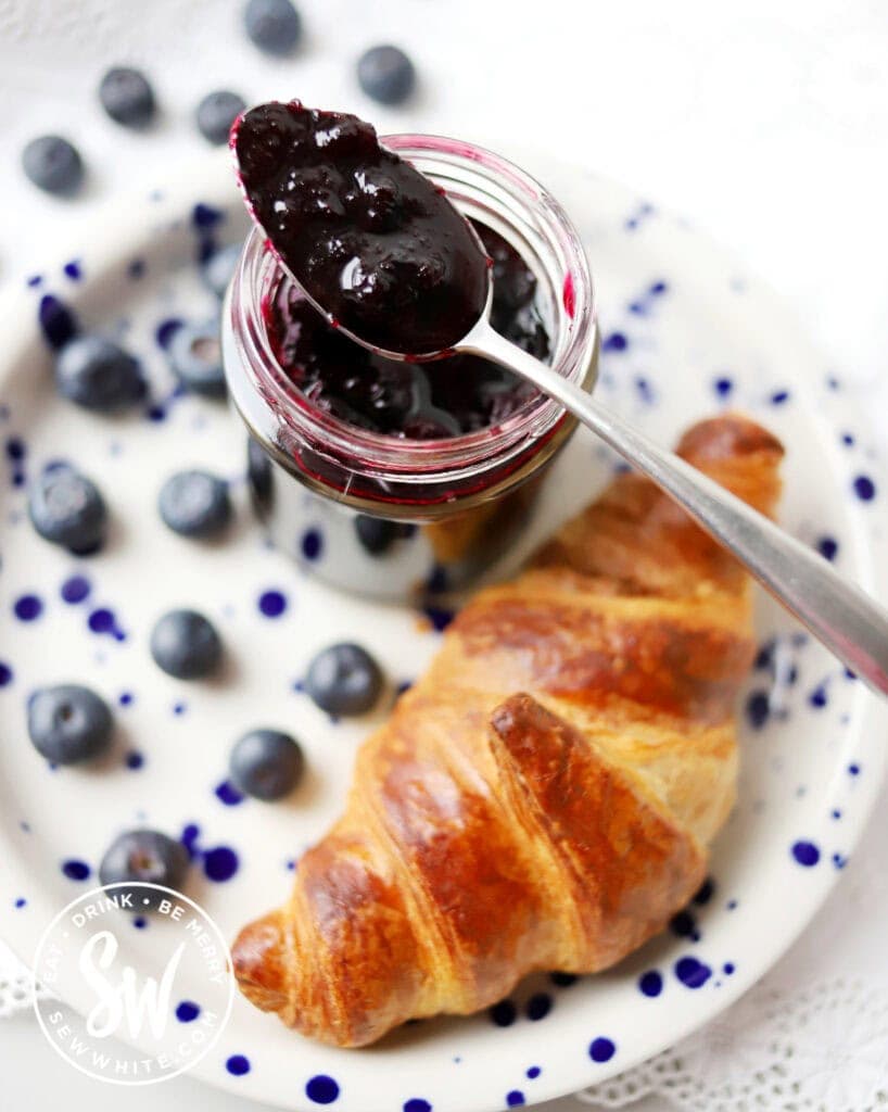 top view of a spoon full of no pectin small batch blueberry jam