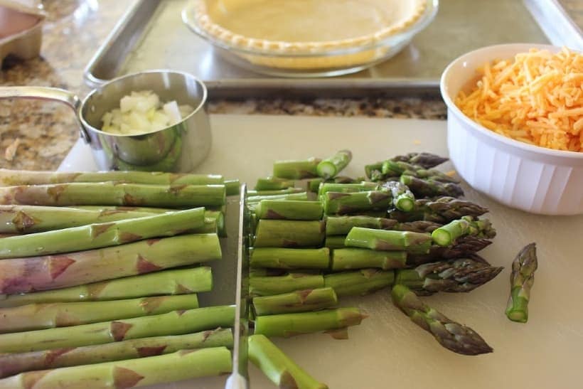 Asparagus & Ham Quiche is perfect for any meal - breakfast, brunch, lunch or dinner. This easy asparagus recipe is great to serve any time of the year, but especially in the spring when asparagus is in season.