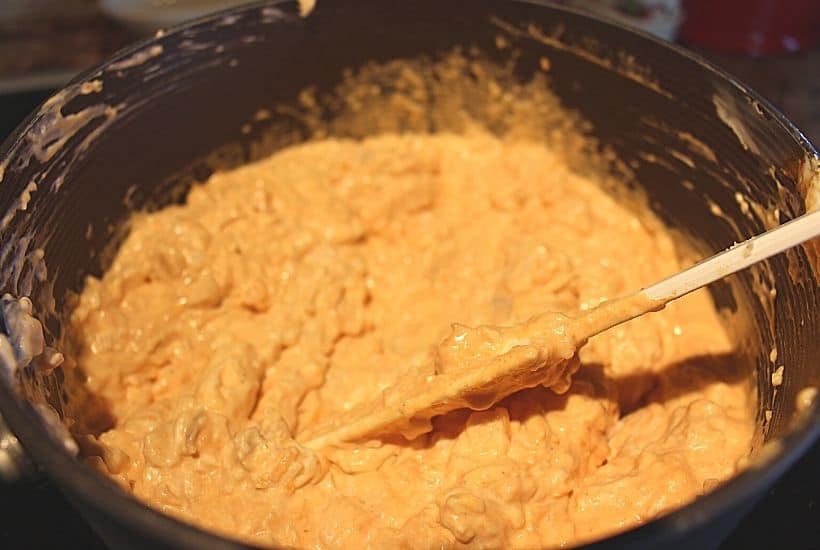 For game day or any day, this Buffalo Chicken Dip recipe is a winner. It's warm, creamy, and loaded with cheese, chicken, and wing sauce, this decadent appetizer is perfect for parties or ideal for game day tailgating!