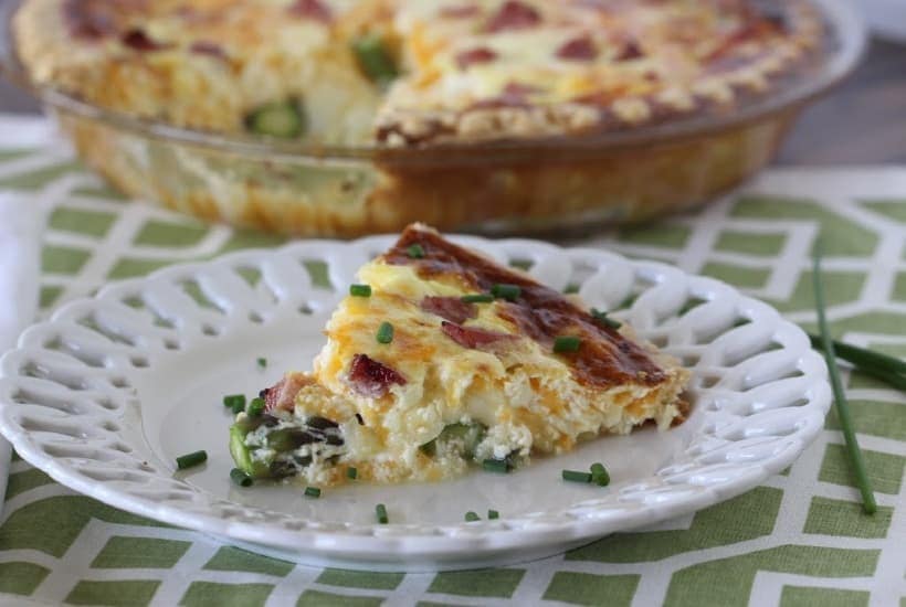 Asparagus & Ham Quiche is perfect for any meal - breakfast, brunch, lunch or dinner. This easy asparagus recipe is great to serve any time of the year, but especially in the spring when asparagus is in season.