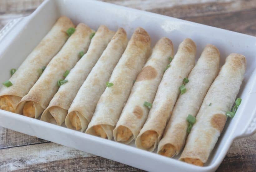 These Baked Buffalo Chicken Flautas as crispy, cheesy and full of buffalo chicken flavor. Feed a crowd this Cinco de Mayo with these delicious Baked Buffalo Chicken Flautas. If you love Mexican food, try this easy Mexican recipe. Flautas are quick and easy to prepare. Flautas are a great make-ahead freezer meal too.