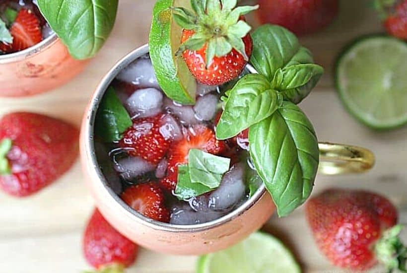 This simple Strawberry Basil Moscow Mule is a refreshing drink recipe. Grab your copper mugs and make this easy cocktail recipe. 