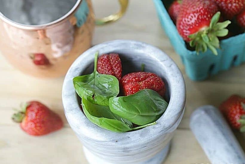 This simple Strawberry Basil Moscow Mule is a refreshing drink recipe. Grab your copper mugs and make this easy cocktail recipe. 