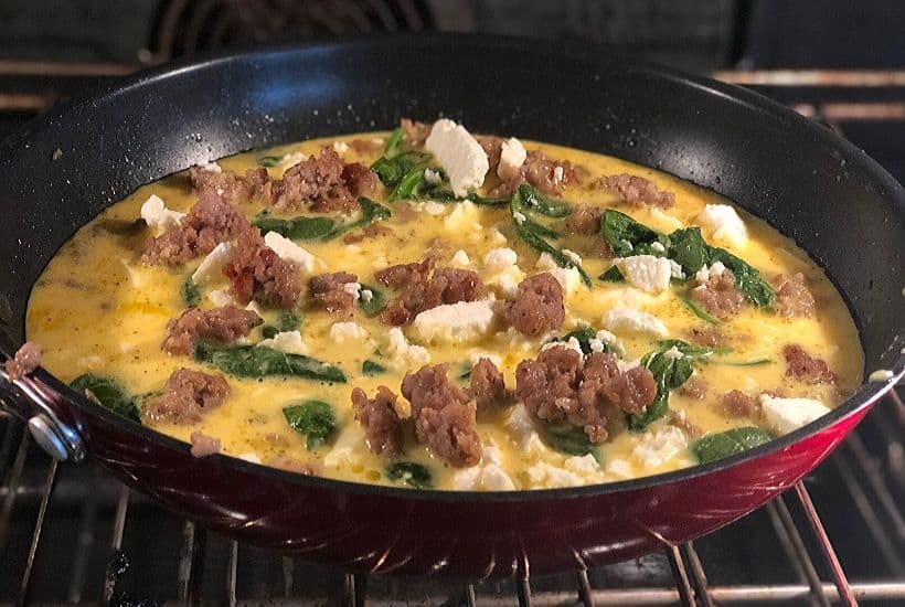 Start your day off right with this Sausage, Spinach and Feta Frittata recipe. This easy frittata recipe is perfect for breakfast or brunch. This make-ahead breakfast option is perfect throughout the week for a quick meal or snack. #frittata #sausagefrittata 