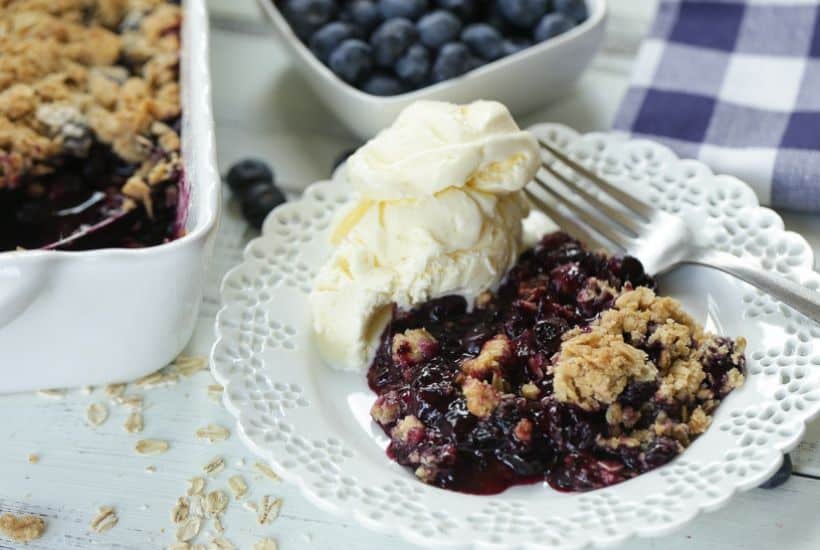 It's blueberry season! This easy blueberry crisp recipe it the perfect way to celebrate. This fruit crisp is a super simple summer dessert and perfect with a dollop of ice cream. #blueberrycrisp #blueberryrecipe #summerdessert