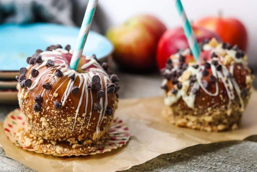 Nothing says fall like crisp apples. Add a sweet twist to your apples with this easy and delicious Homemade Caramel Apples recipe. This is a fun fall apple dessert to decorate and eat! These yummy apple snacks will be a hit, #applerecipe #caramelapples #candyapples #falldessert