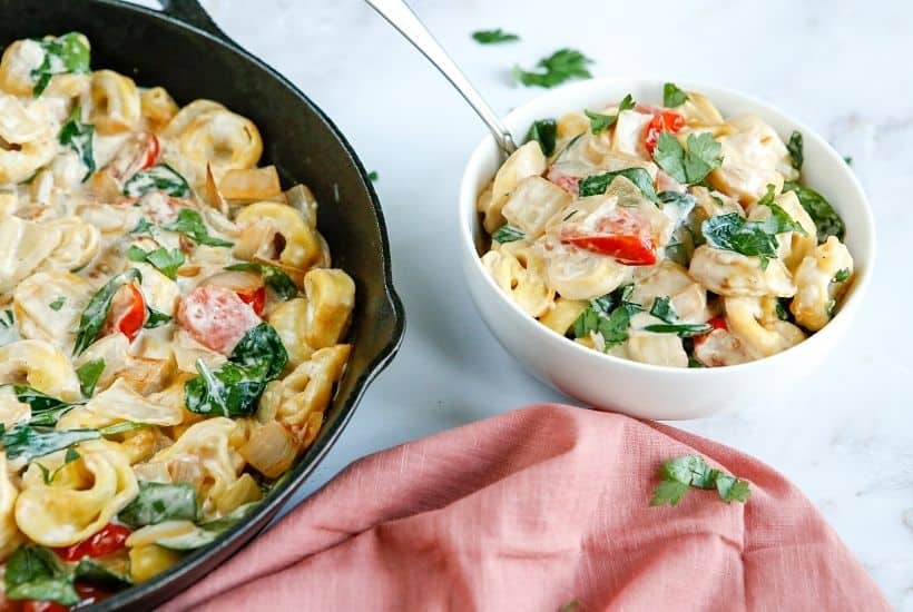 Enjoy the fresh taste of tortellini, shredded cheese, baby spinach, and tomatoes mixed to create this tasty and fulfilling Creamy Tortellini Skillet.