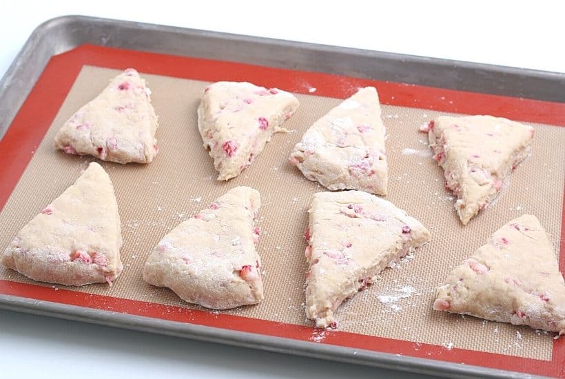 Impress your family with homemade baked goods that they can have for breakfast or a snack. This Strawberry Scones recipe is fun to make and will stay fresh for several days. These fresh-baked scones are soft, flaky and bursting with juicy strawberries! This is also a great freezer friendly recipe. Bake a batch of these fresh strawberry scones and freeze to enjoy at a later time.