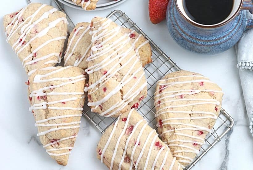 Impress your family with homemade baked goods that they can have for breakfast or a snack. This Strawberry Scones recipe is fun to make and will stay fresh for several days. These fresh-baked scones are soft, flaky and bursting with juicy strawberries! This is also a great freezer friendly recipe. Bake a batch of these fresh strawberry scones and freeze to enjoy at a later time.