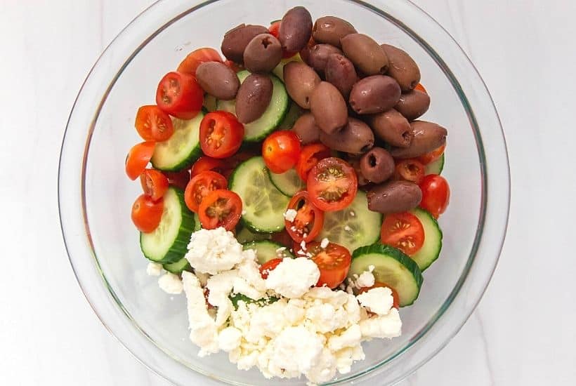 If you’d like a light and refreshing side dish, try this Greek Salad. It consists of healthy ingredients that are good for you, including cucumbers and red onions. This is an easy salad recipe to serve as a simple side dish, potluck recipe or at a summer picnic.