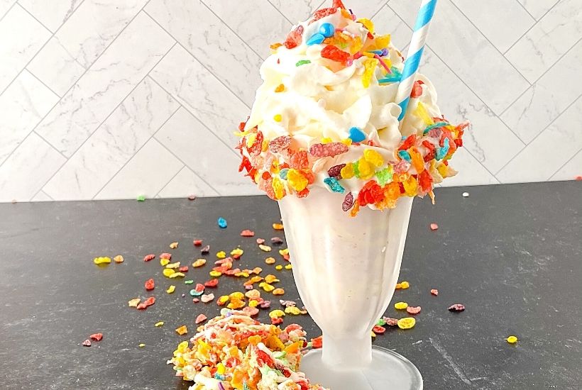 This is a milkshake recipe you don't want to pass up. This amazing Fruity Pebbles milkshake is Perfect blender Fruity Pebbles cereal vanilla ice cream milkshake for kids party food, Summer drink, or an easy dessert recipe. This creamy milkshake with Fruity Pebbles will definitely please any crowd. Check out the best vanilla Fruity Pebbles ice cream milkshake today