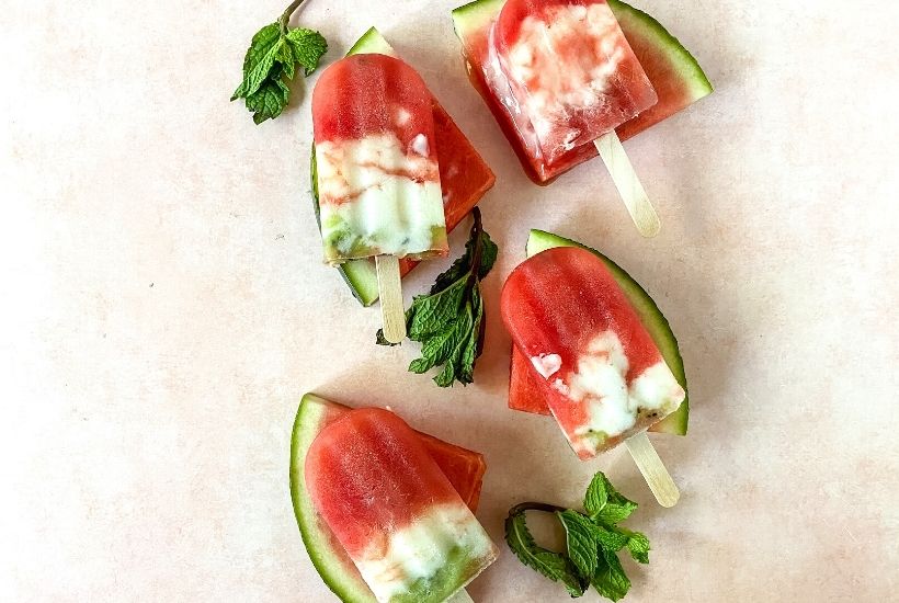 Stay hydrated and cool on a hot day with these flavorful Watermelon Pops. Made with fresh ingredients in a blender, these popsicles are delicious and naturally good for you. Watermelon Popsicles are a fresh frozen treat containing watermelon, kiwi, yogurt, and a few other ingredients. These pops get placed in the freezer until they’re cold and are perfect for consuming on a hot day.