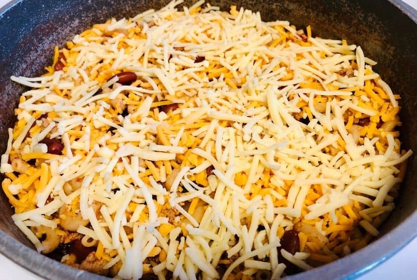 Prepare a fulfilling meal for the family with this wholesome and hearty Chili Mac. Loaded with flavor, this easy comfort food recipe is perfect to make for lunch or dinner with a side of cornbread or garlic bread! Chili Mac and Cheese is an easy weeknight meal idea.