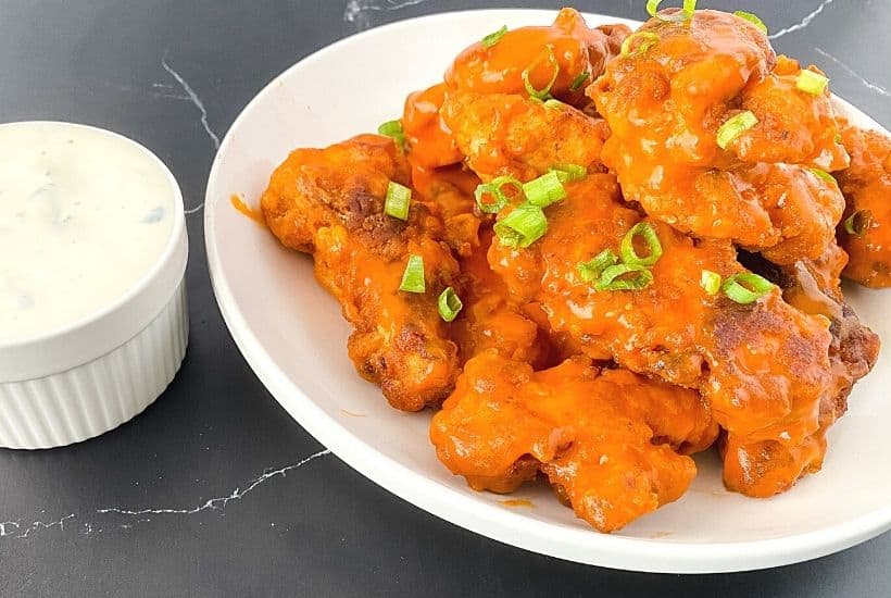 Easy homemade buffalo chicken tenders with ranch dipping sauce.