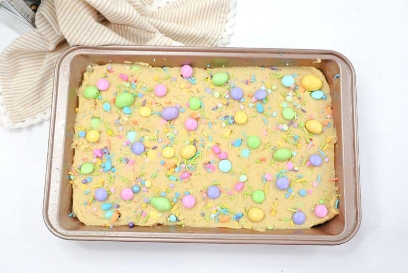 Make fun and flavorful Easter Cookie Bars for the holiday. These easy cookie bars are sure to be a huge hit for your Easter celebration. These thick and chewy M&M Cookies bars are perfect for any holiday or occasion. Fill them with chocolate chips, M&M's, or any chopped chocolate candy. They're also perfect to use up leftover Halloween candy.