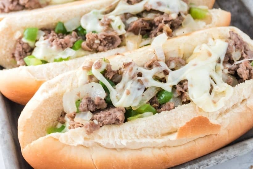 Enjoy the fresh flavor of a thinly sliced steak with cheese, onions, and peppers on rolls with this recipe for homemade Philly Cheesesteaks. If you’ve ever visited Philly (or any of the towns surrounding Philadelphia), you know that they are best known for the famous Philly Cheesesteak. This easy cheesesteak recipe is great to have for lunch and dinner.